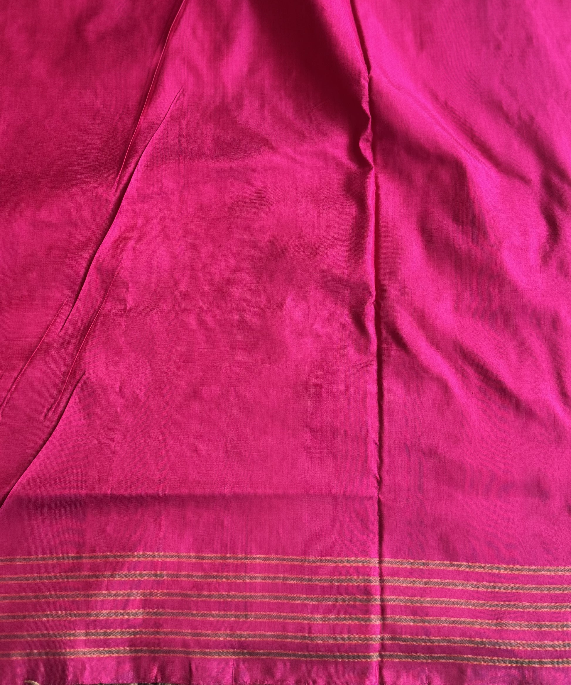Ikkat Pattu Saree Green colored complemented with a Pink Patolla border. - Sampradaya Designer Studio