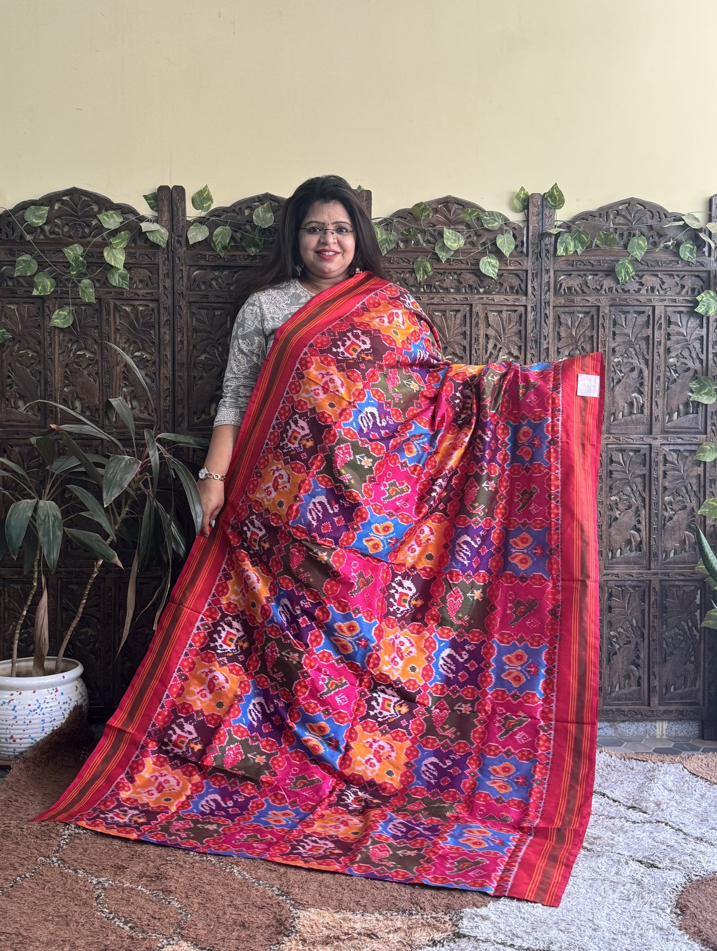 Ikkat Pattu Saree Multi colored complemented with a Red Patolla border. - Sampradaya Designer Studio