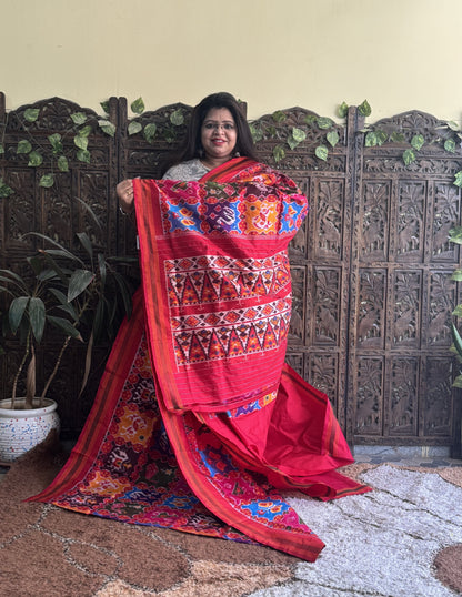 Ikkat Pattu Saree Multi colored complemented with a Red Patolla border. - Sampradaya Designer Studio