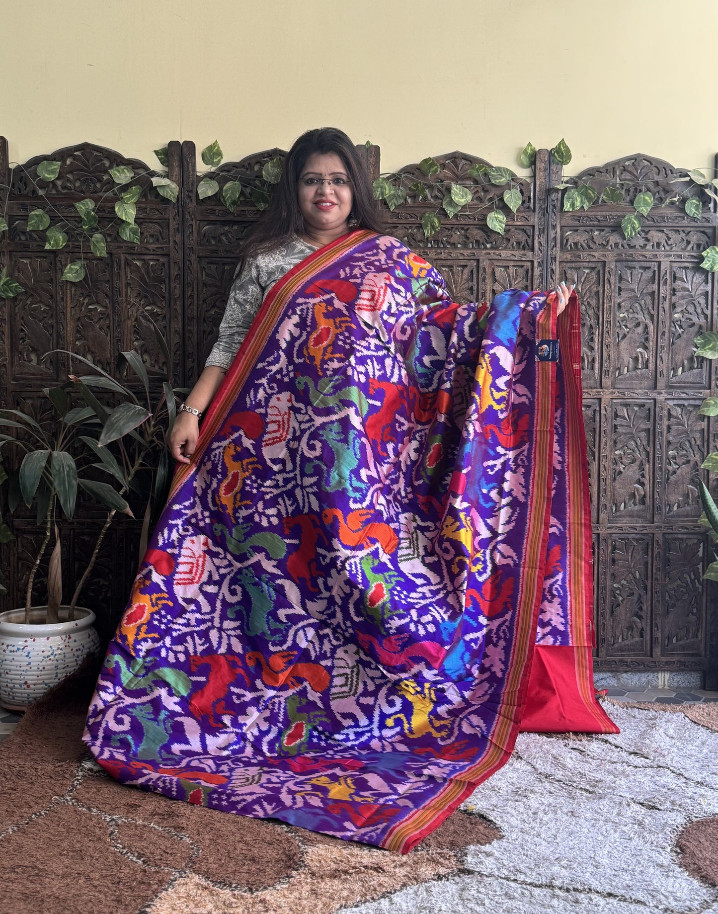 Ikkat Pattu Saree Dark Purple colored complemented with a Red Patolla border. - Sampradaya Designer Studio