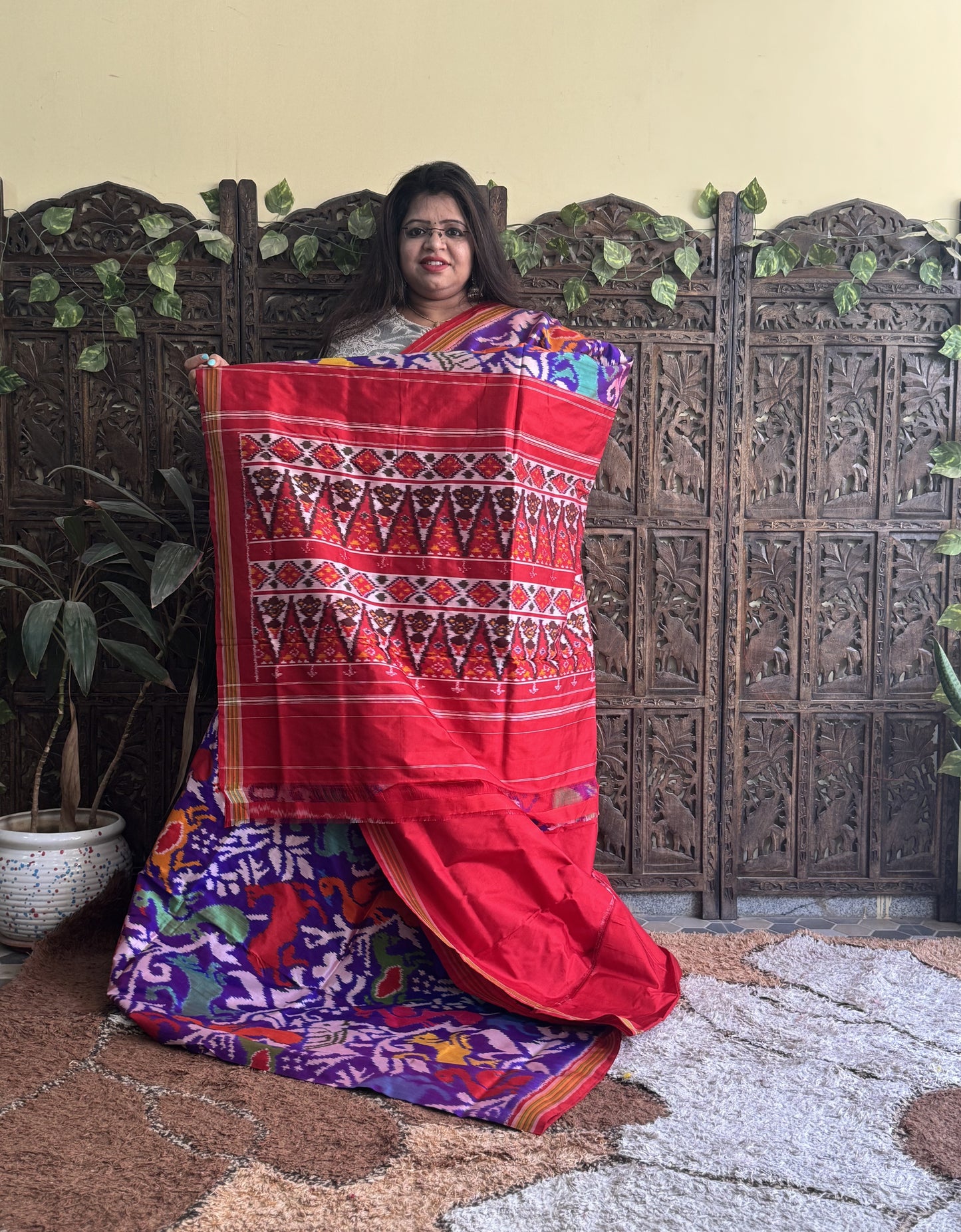 Ikkat Pattu Saree Dark Purple colored complemented with a Red Patolla border. - Sampradaya Designer Studio