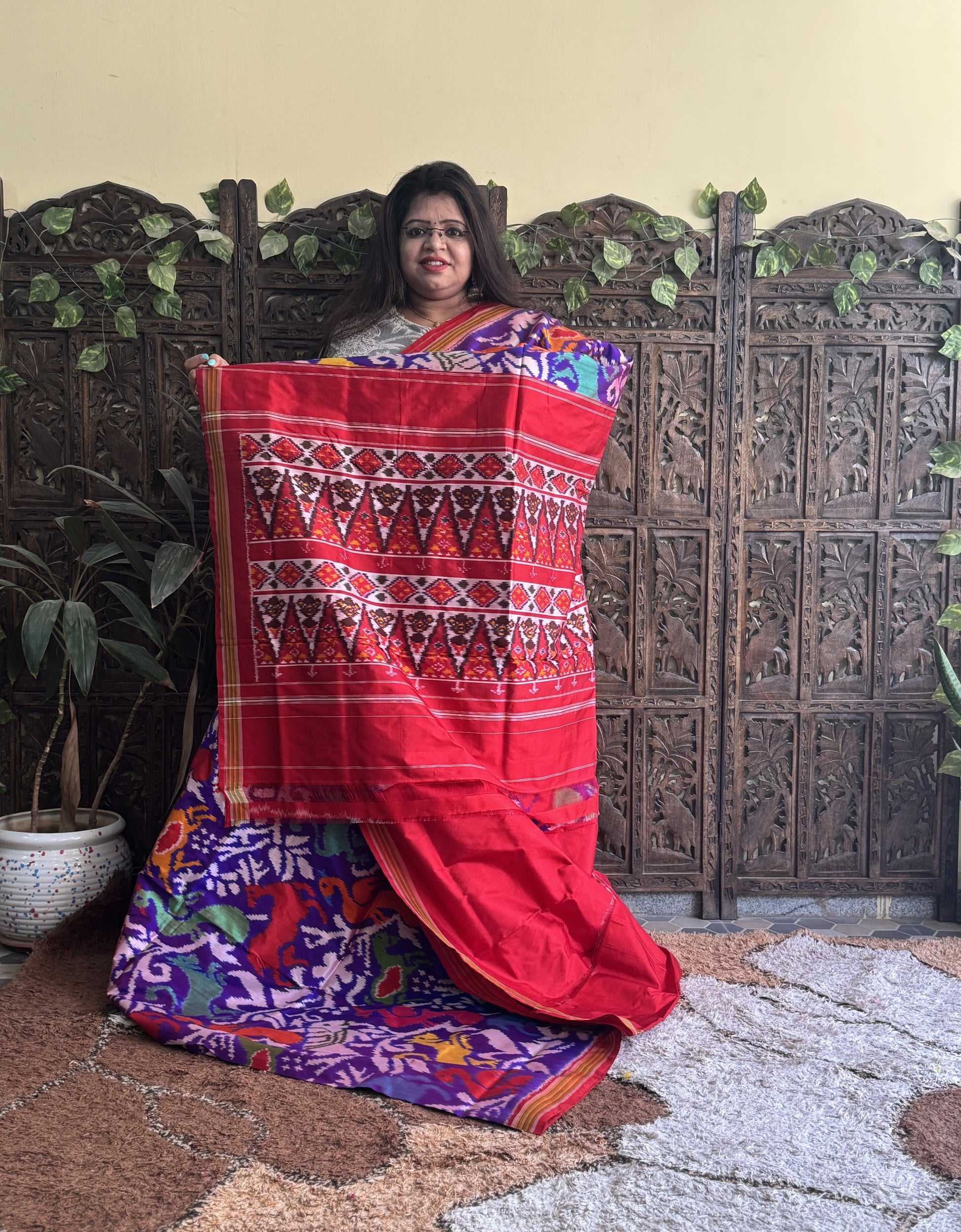 Ikkat Pattu Saree Dark Purple colored complemented with a Red Patolla border. - Sampradaya Designer Studio