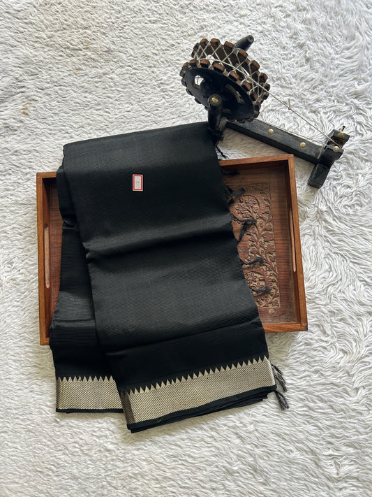 Mangalagiri Plain Pattu Saree Black colored complemented with a Zari Border. - Sampradaya Designer Studio