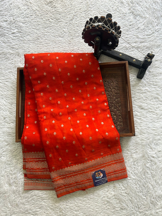 Semi Georgette Saree Orange Colored Elegantly Paired with a Zari Border. - Sampradaya Designer Studio