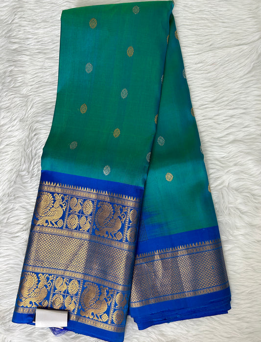 Gadwal Pattu Saree Peacock Blue Colored Complemented With a Pattu Royal Blue Border - Sampradaya Designer Studio