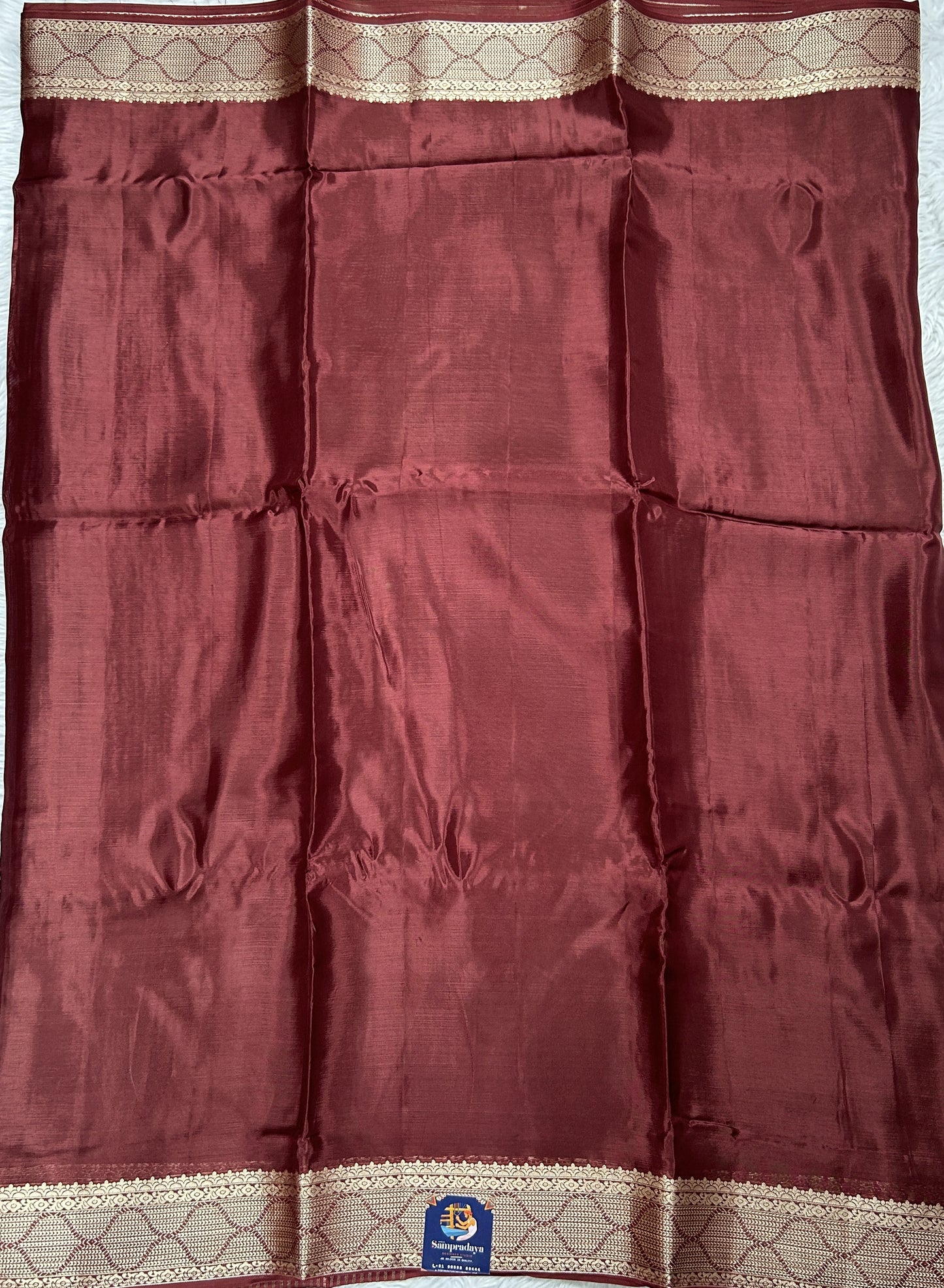 Satin Georgette Saree Brown Colored Complemented with a Zari Border. - Sampradaya Designer Studio