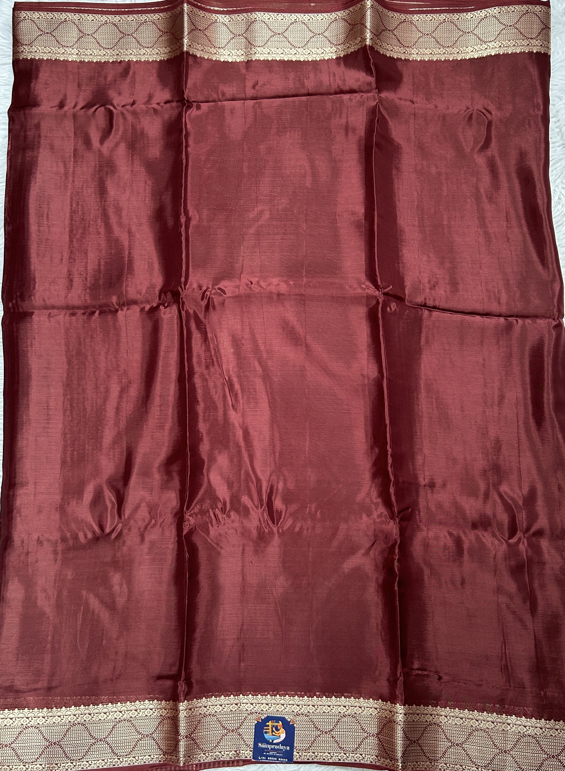 Satin Georgette Saree Brown Colored Complemented with a Zari Border. - Sampradaya Designer Studio