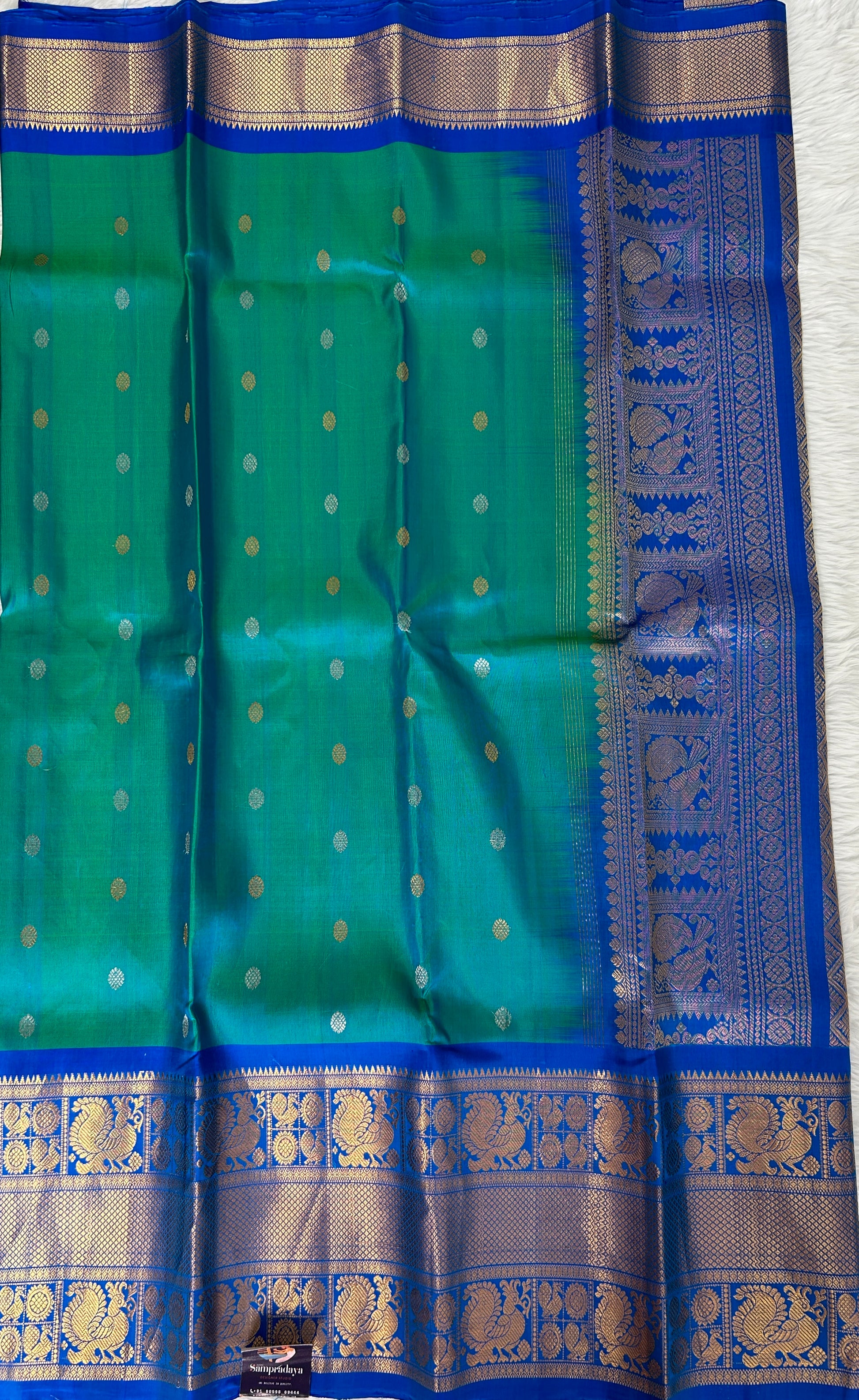 Gadwal Pattu Saree Peacock Blue Colored Complemented With a Pattu Royal Blue Border - Sampradaya Designer Studio