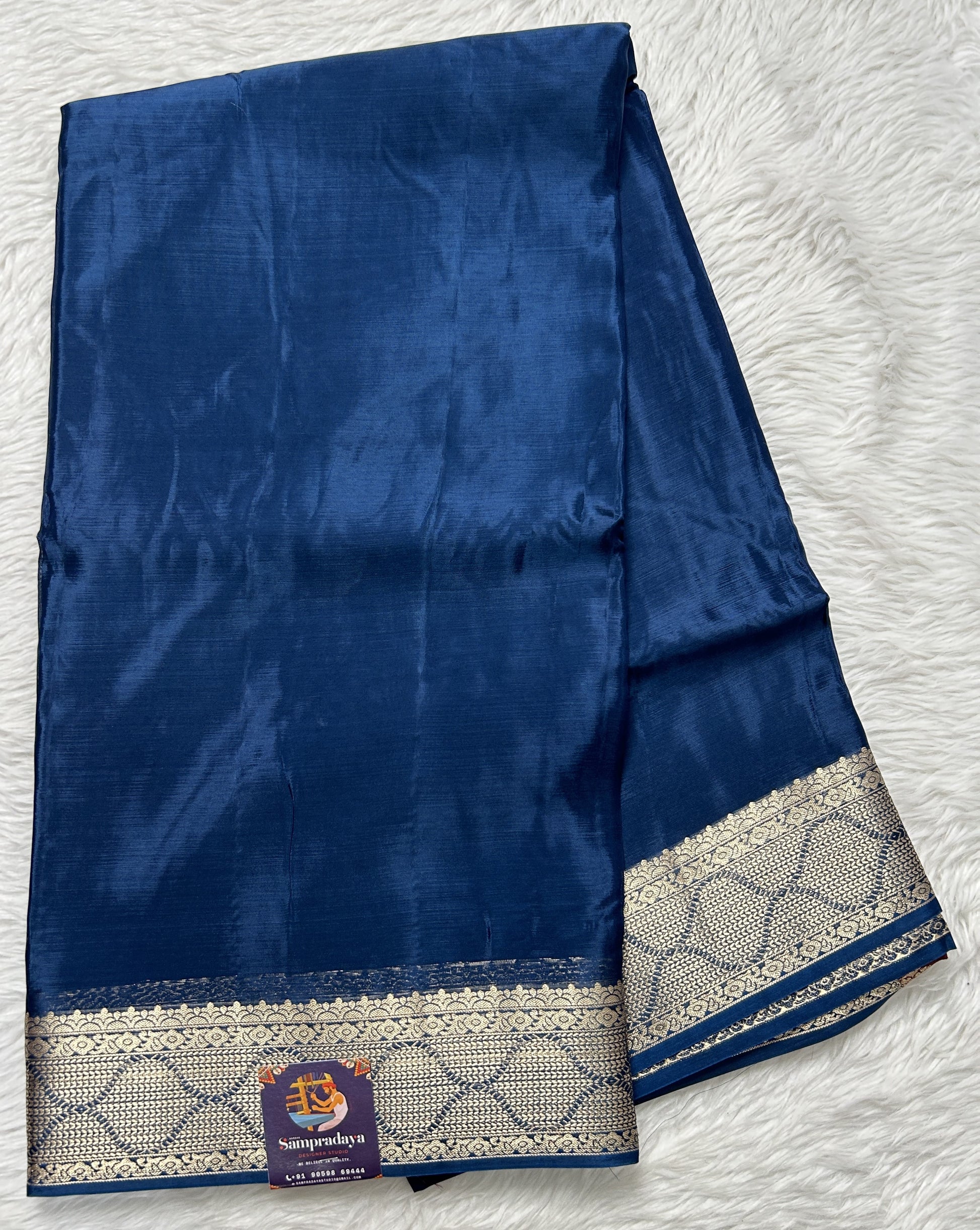 Satin Georgette Saree Indigo Blue Colored Complemented with a Zari Border. - Sampradaya Designer Studio