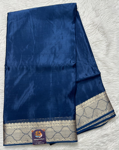 Satin Georgette Saree Indigo Blue Colored Complemented with a Zari Border. - Sampradaya Designer Studio