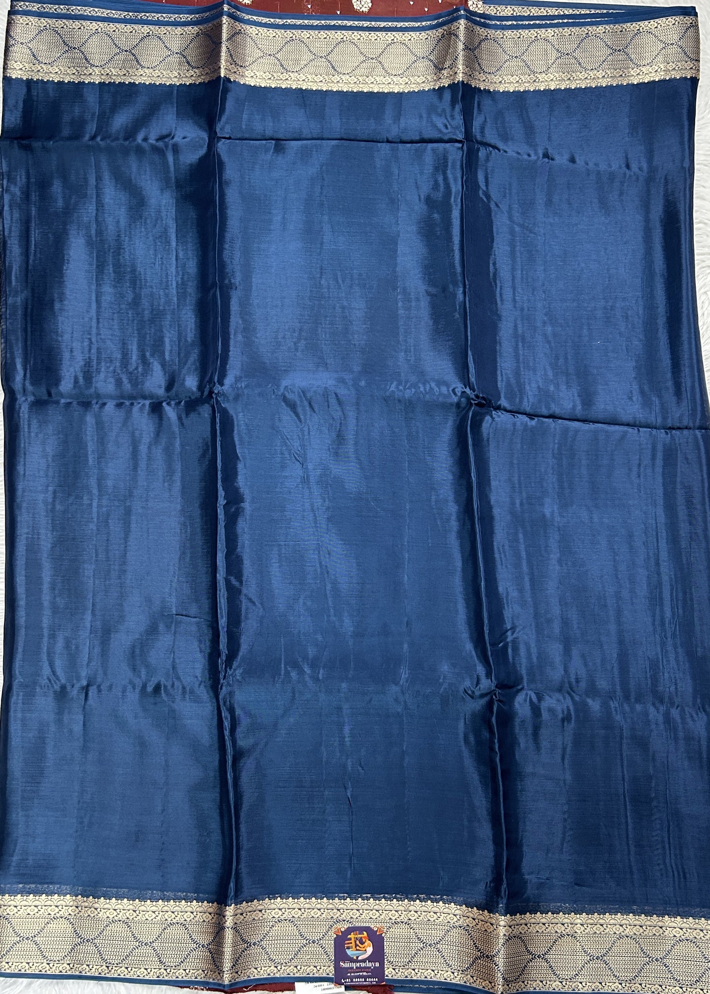 Satin Georgette Saree Indigo Blue Colored Complemented with a Zari Border. - Sampradaya Designer Studio