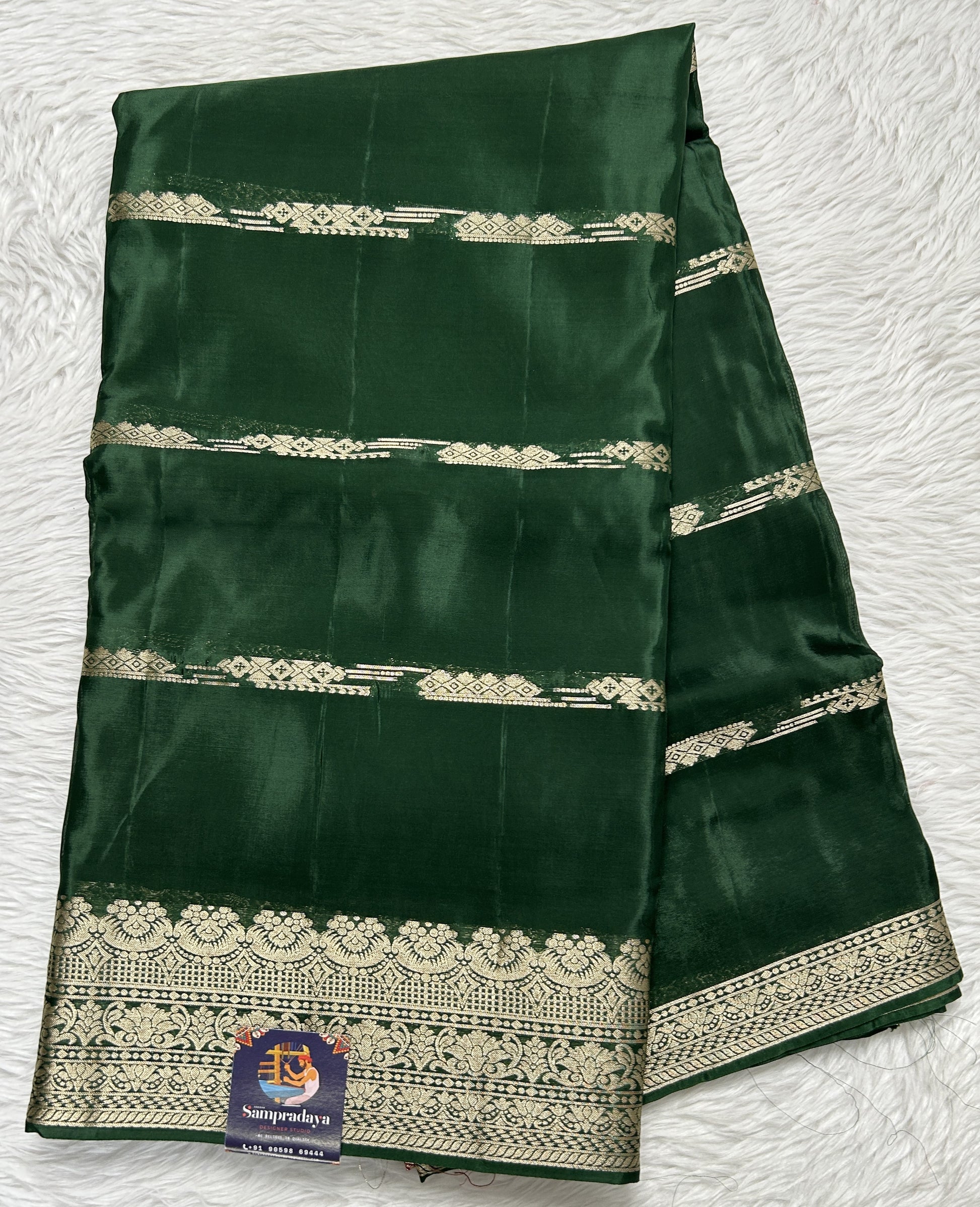 Satin Georgette Saree Bottle Green Colored Complemented with a Zari Border. - Sampradaya Designer Studio