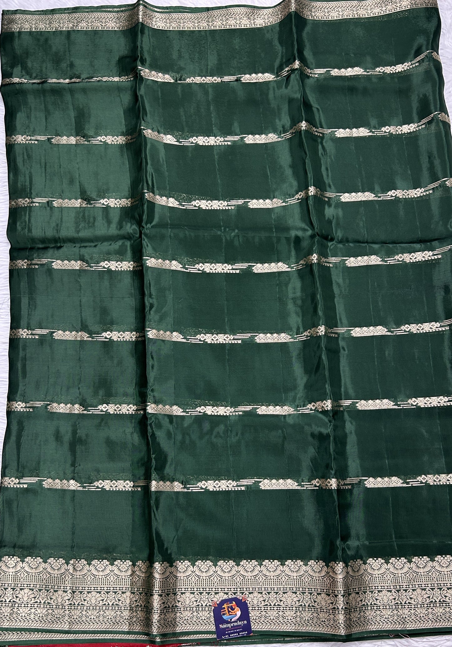 Satin Georgette Saree Bottle Green Colored Complemented with a Zari Border. - Sampradaya Designer Studio