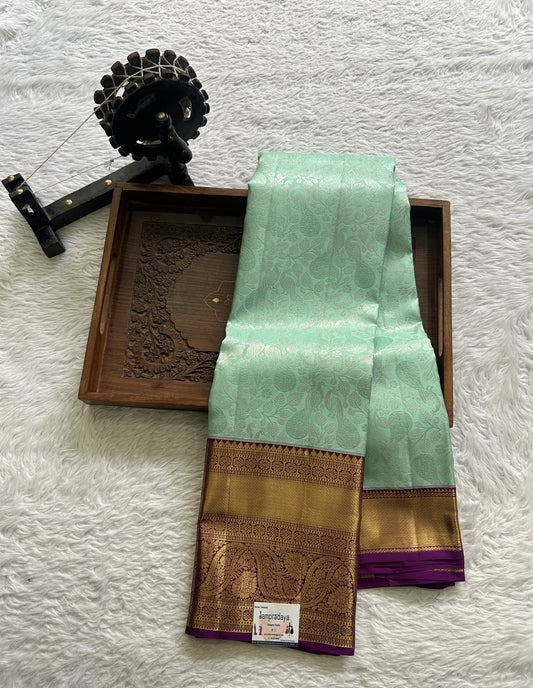 Kanjivaram Bridal Silk Saree Aqua Blue colored complemented with a Zari border. - Sampradaya Designer Studio