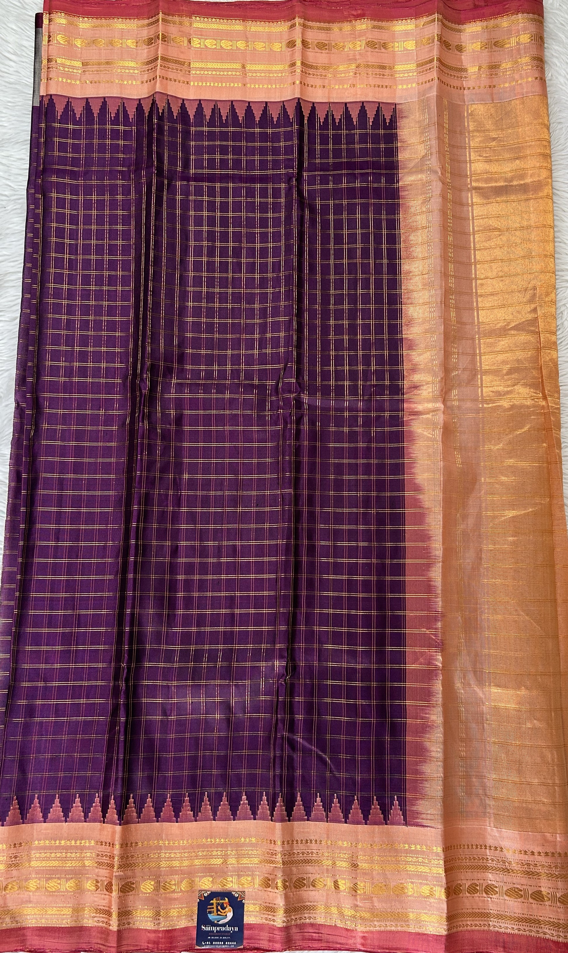 Gadwal Pattu Purple Colored Saree Complemented With a Peach Color Kanchi Gap Border - Sampradaya Designer Studio
