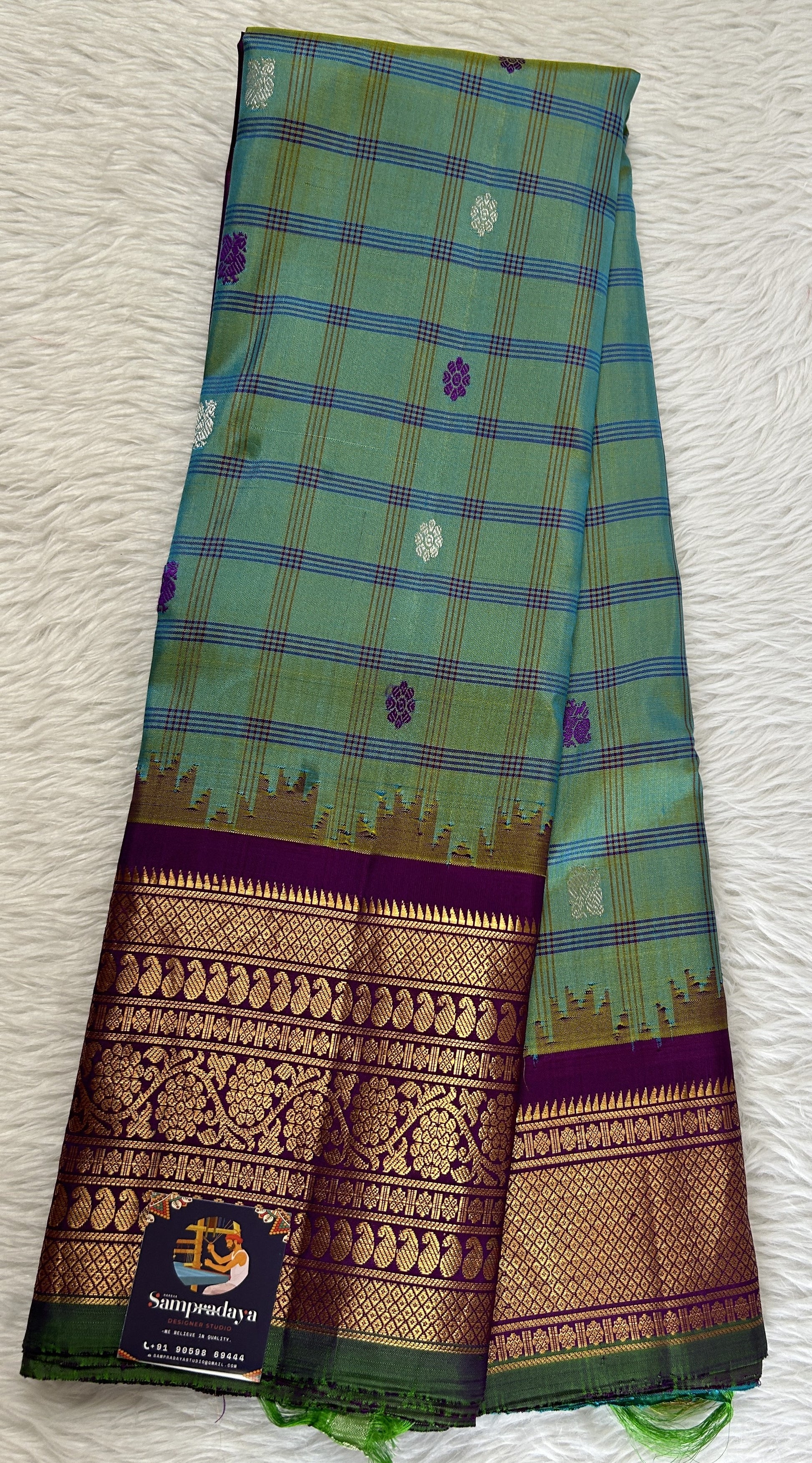 Gadwal Silk Saree Blue Green Colored Complemented With a Violet Color Kanchi Border - Sampradaya Designer Studio