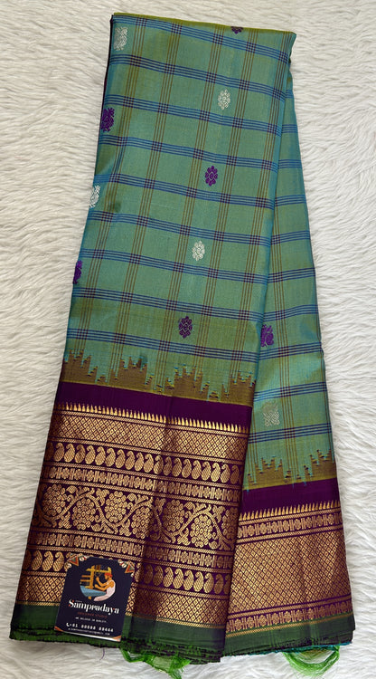 Gadwal Silk Saree Blue Green Colored Complemented With a Violet Color Kanchi Border - Sampradaya Designer Studio