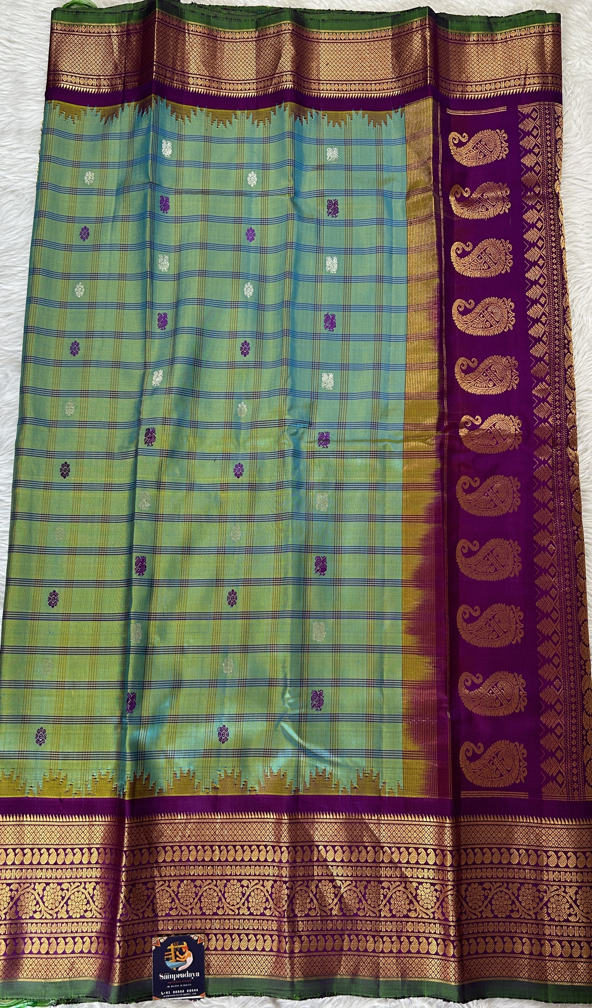 Gadwal Silk Saree Blue Green Colored Complemented With a Violet Color Kanchi Border - Sampradaya Designer Studio