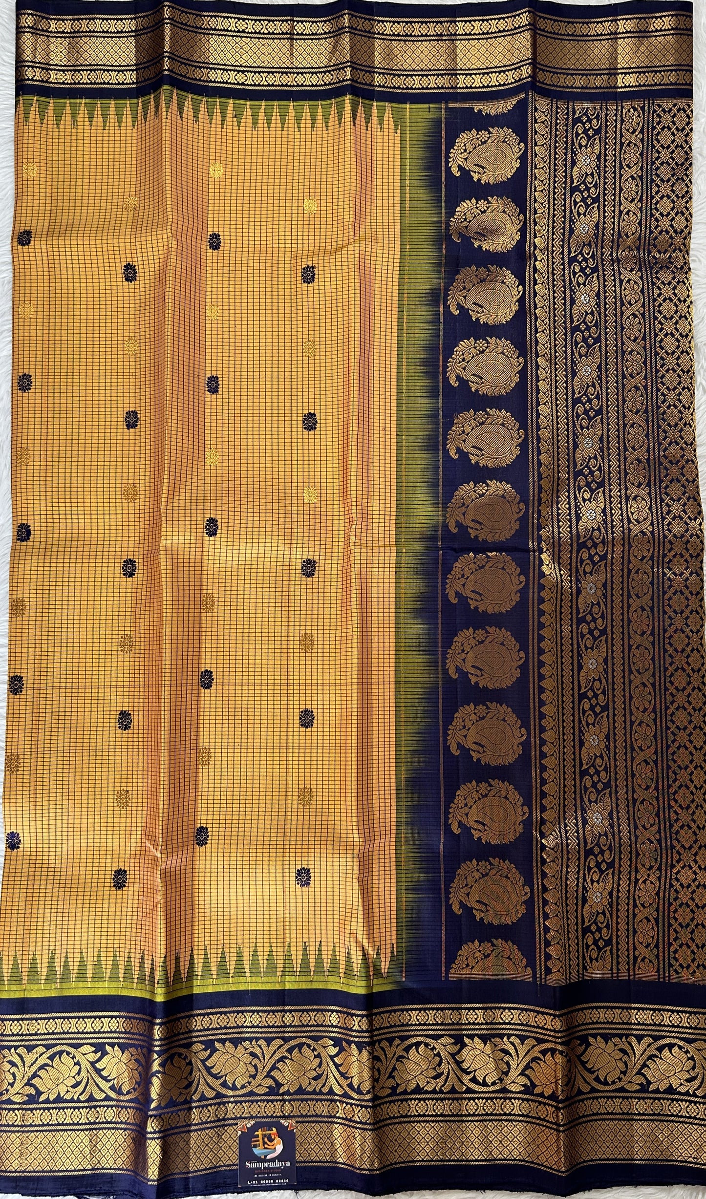 Gadwal Silk Saree Light Orange Colored Complemented With a Navy Blue Color Kanchi Border - Sampradaya Designer Studio