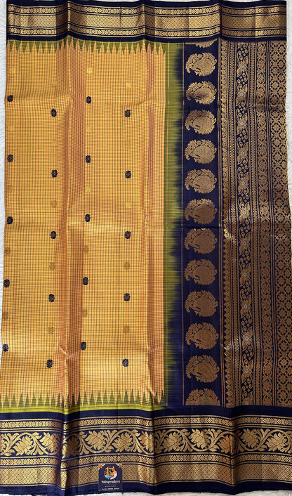 Gadwal Silk Saree Light Orange Colored Complemented With a Navy Blue Color Kanchi Border - Sampradaya Designer Studio