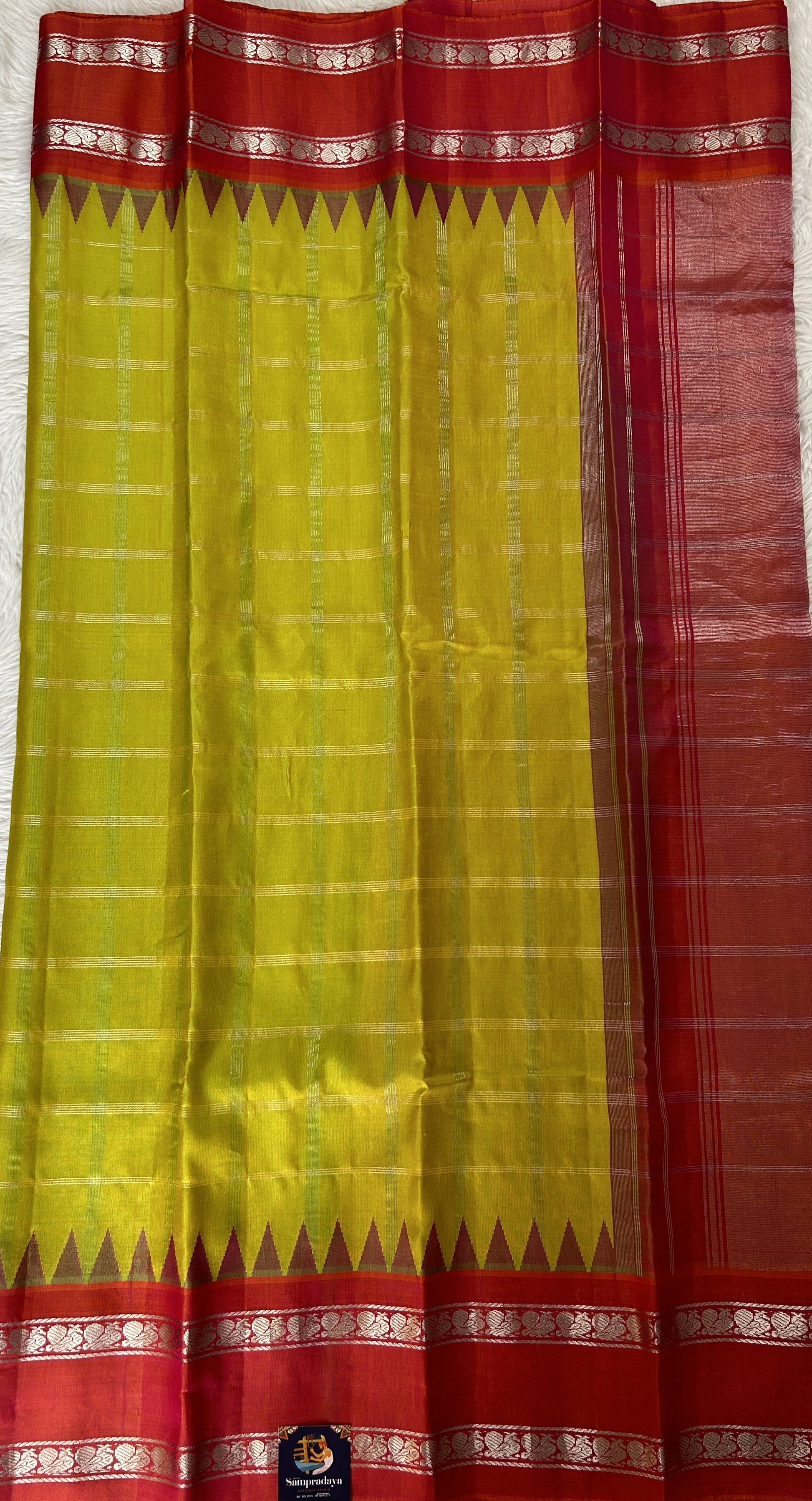 Gadwal Silk Saree Lemon Yellow Colored Complemented With a Peachy Pink Color Kanchi Gap Border - Sampradaya Designer Studio