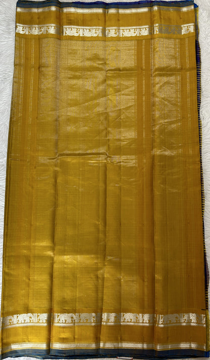 Gadwal Silk Saree Blue and Purple Colored Complemented With a Yellow Color Kanchi Gap Border - Sampradaya Designer Studio