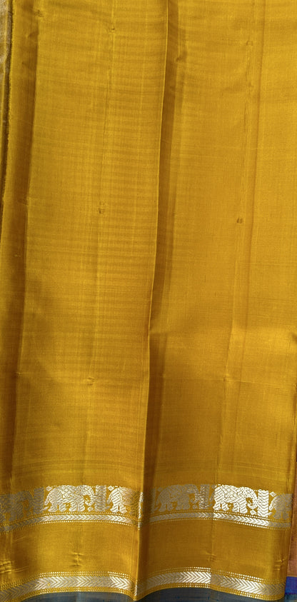 Gadwal Silk Saree Blue and Purple Colored Complemented With a Yellow Color Kanchi Gap Border - Sampradaya Designer Studio