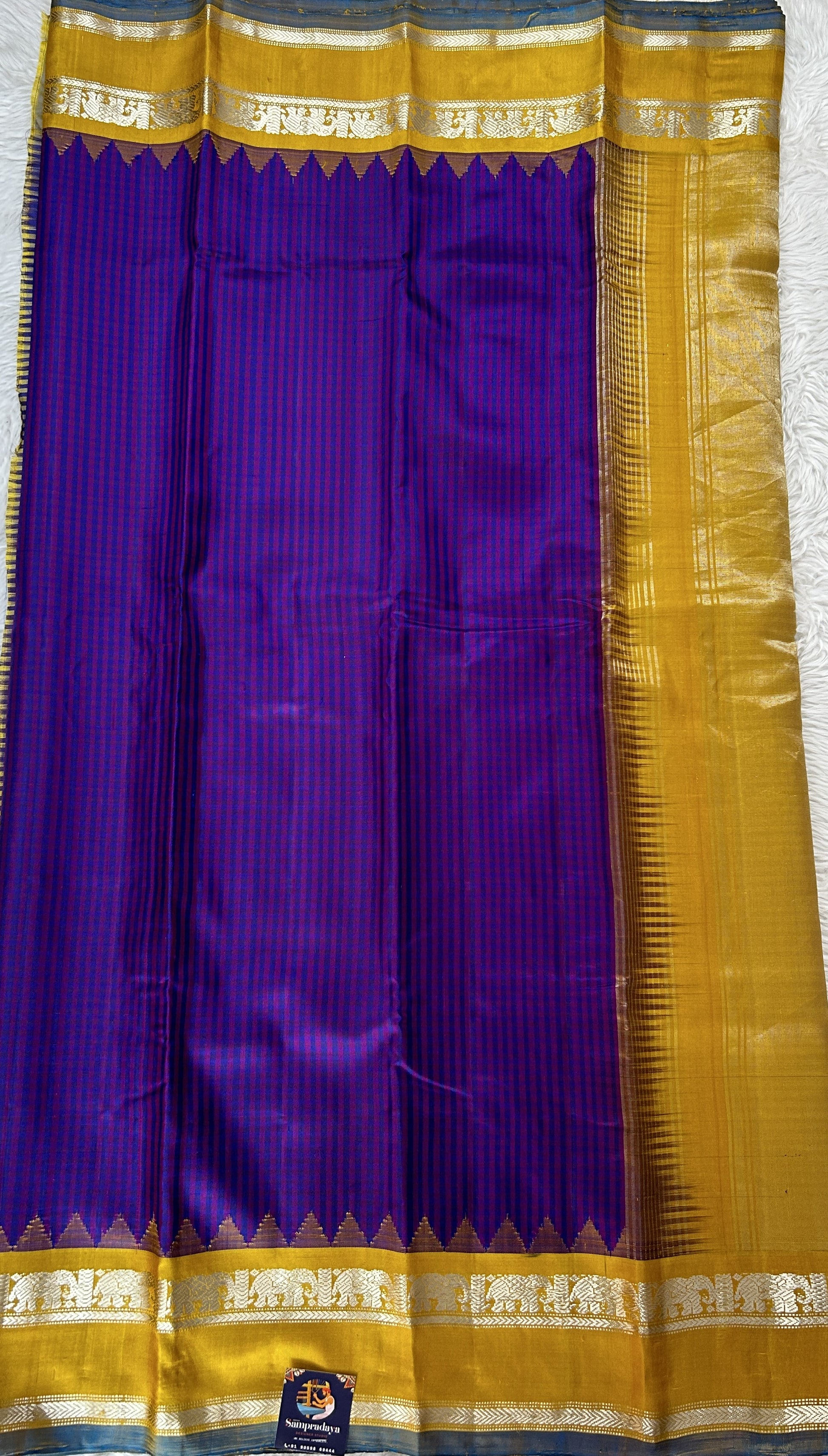 Gadwal Silk Saree Blue and Purple Colored Complemented With a Yellow Color Kanchi Gap Border - Sampradaya Designer Studio