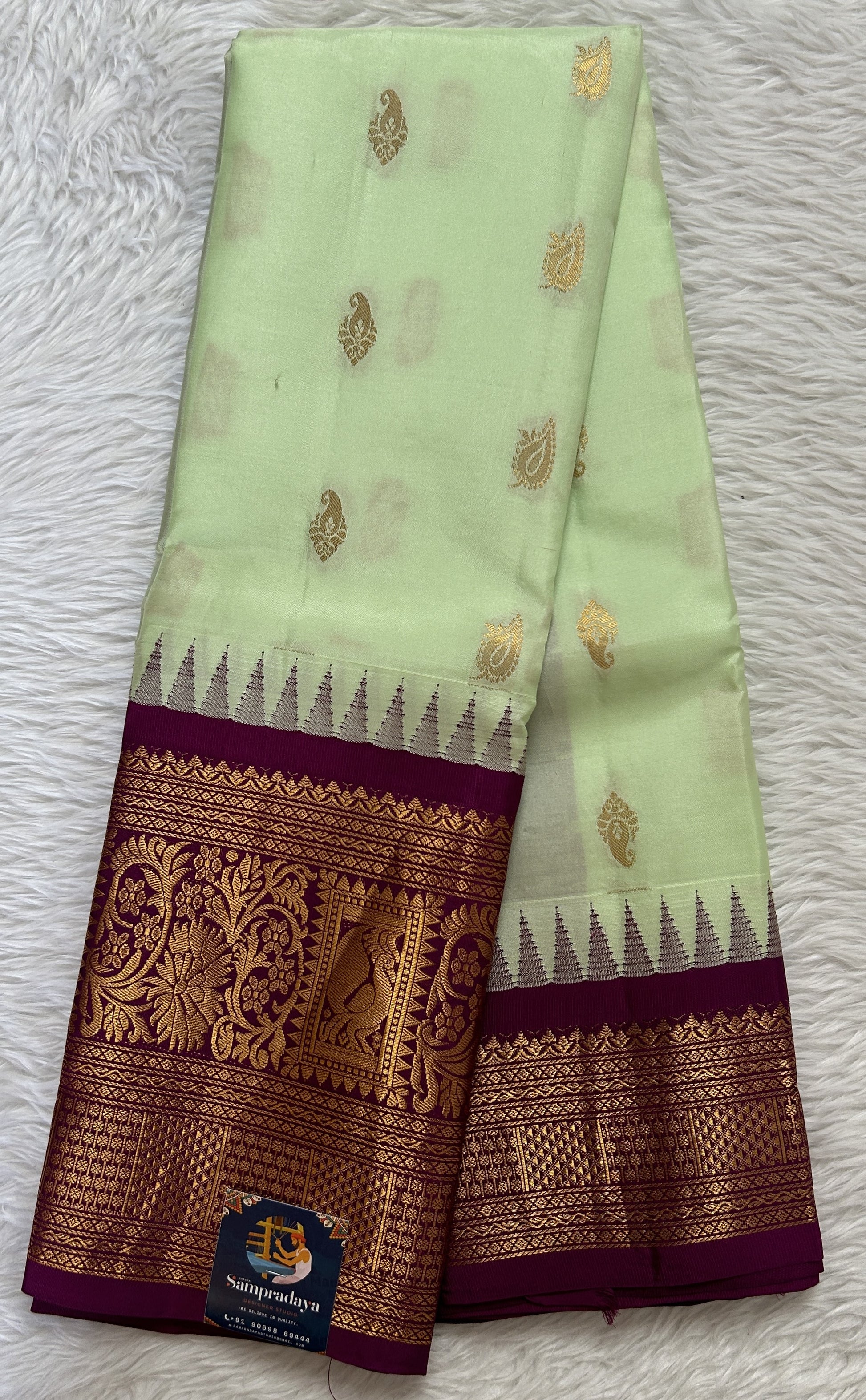 Gadwal Silk Saree Light Green colored complemented with a Magenta Color Kanchi Border - Sampradaya Designer Studio