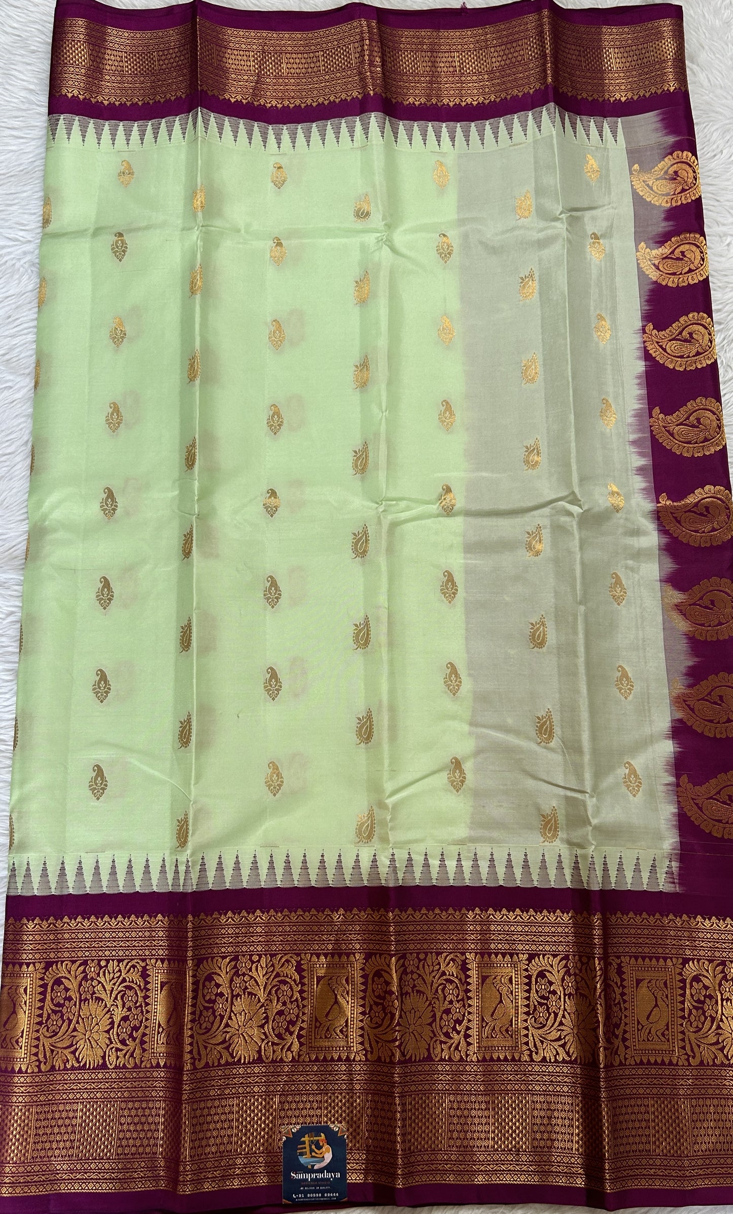 Gadwal Silk Saree Light Green colored complemented with a Magenta Color Kanchi Border - Sampradaya Designer Studio
