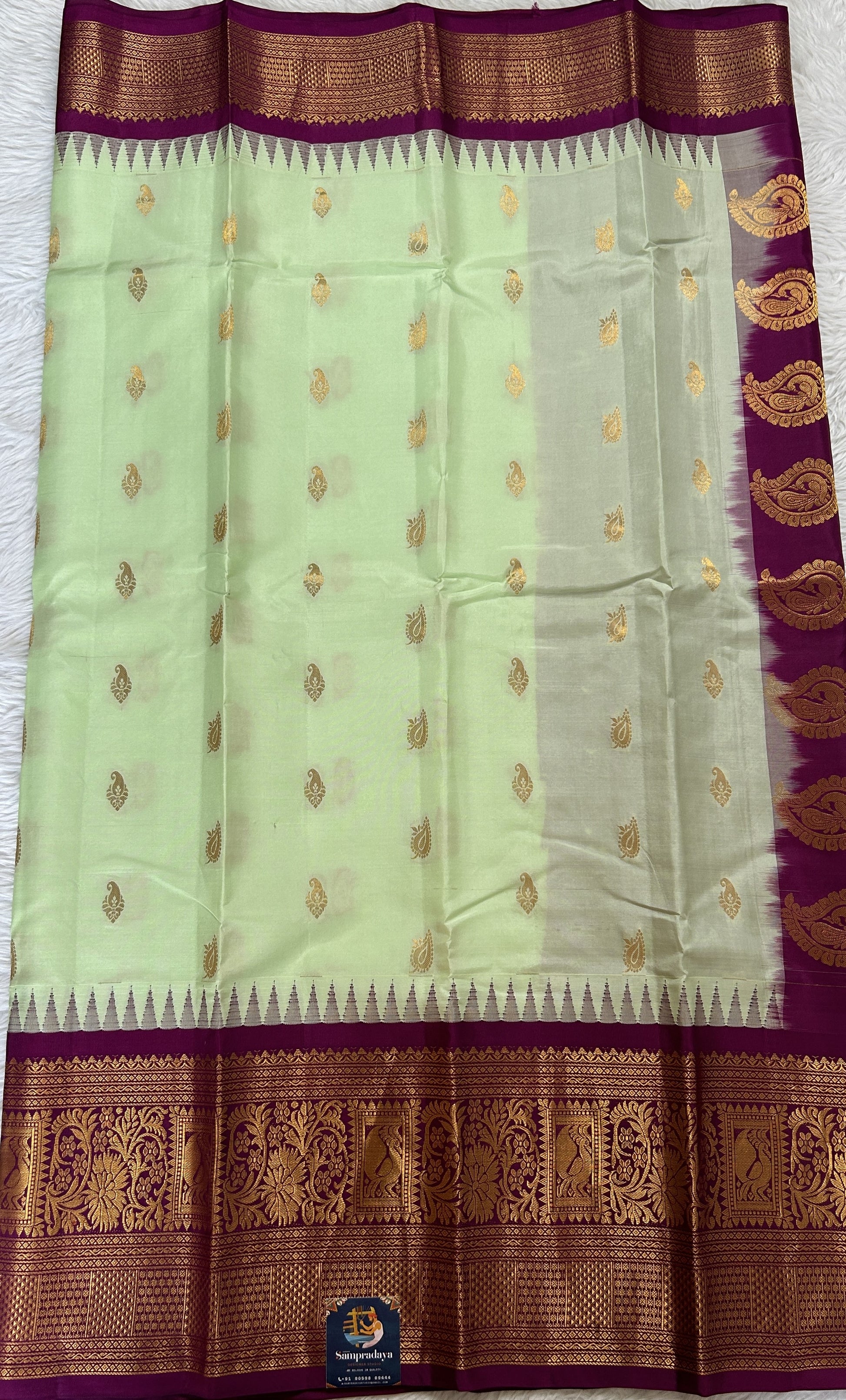 Gadwal Silk Saree Light Green colored complemented with a Magenta Color Kanchi Border - Sampradaya Designer Studio