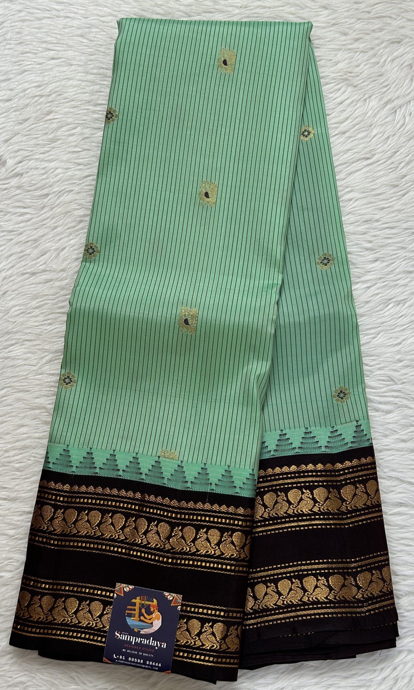 Gadwal Silk Saree Pastel Green colored complemented with a Brown Color Kanchi Gap Border - Sampradaya Designer Studio