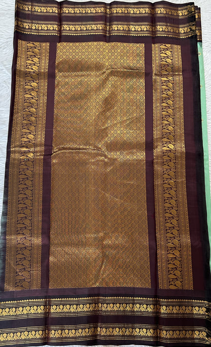 Gadwal Silk Saree Pastel Green colored complemented with a Brown Color Kanchi Gap Border - Sampradaya Designer Studio