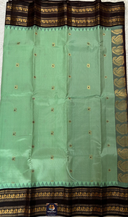 Gadwal Silk Saree Pastel Green colored complemented with a Brown Color Kanchi Gap Border - Sampradaya Designer Studio
