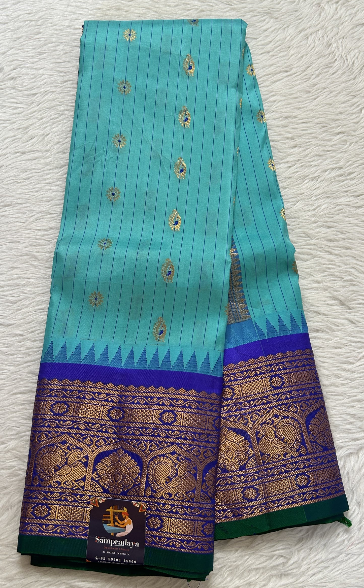Gadwal Silk Saree Sea Blue colored complemented with a Ink Blue Color Kanchi Border - Sampradaya Designer Studio