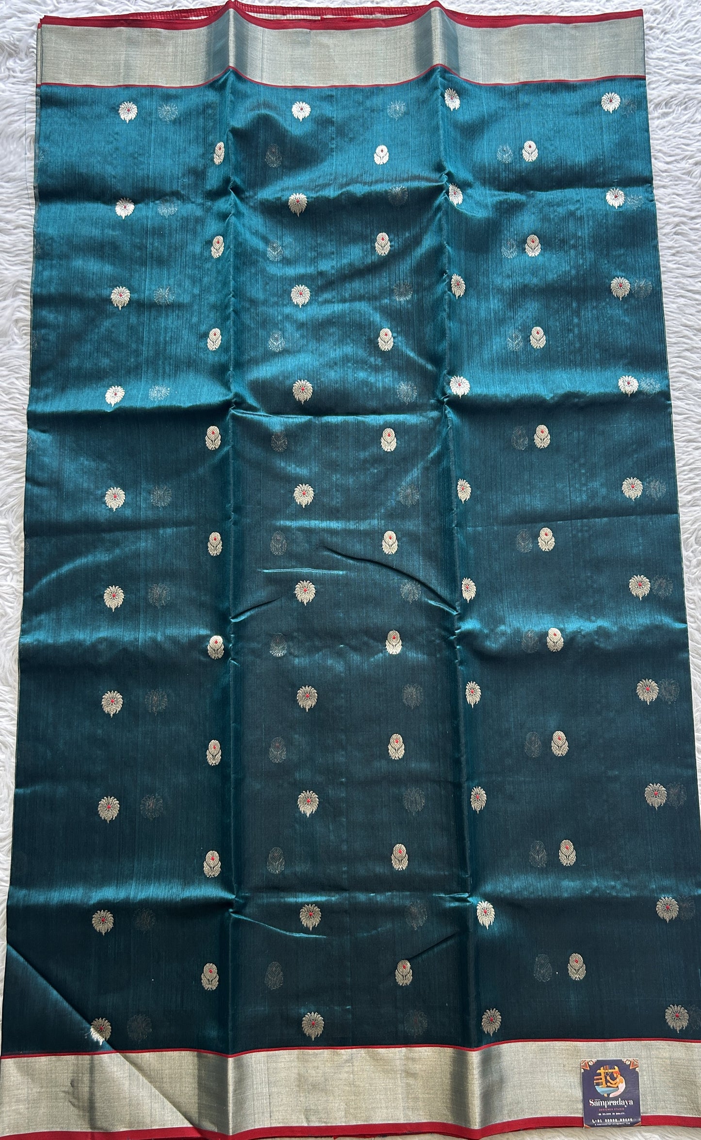Chanderi Silk Saree Peacock Green color complemented with a Silver Zari border - Sampradaya Designer Studio