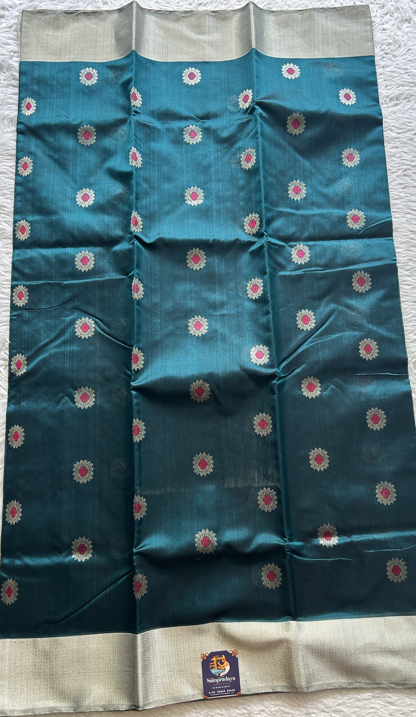 Chanderi Silk Saree Teal Green color complemented with a Zari border - Sampradaya Designer Studio