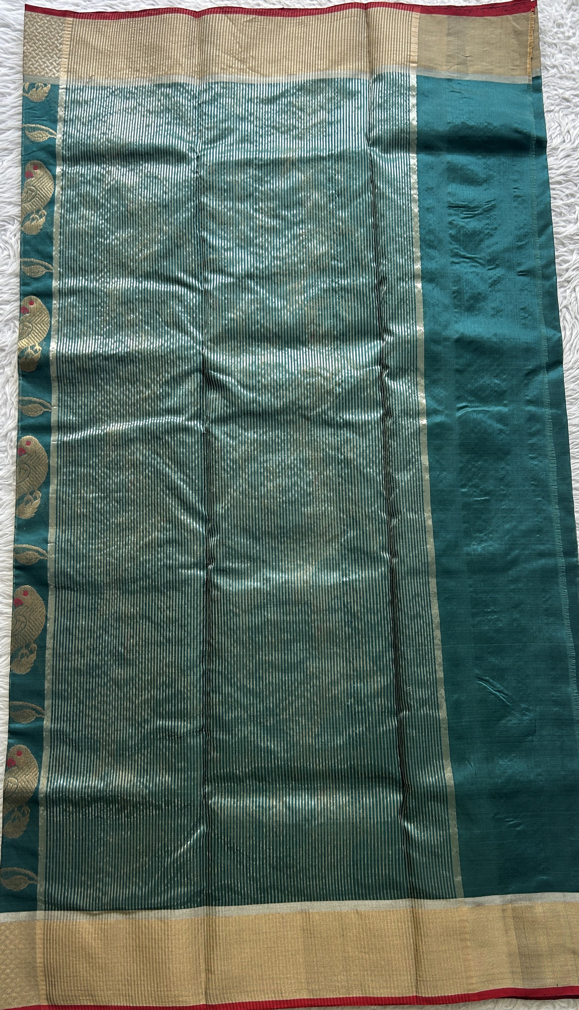 Chanderi Silk Saree Rama Green color complemented with a Zari border - Sampradaya Designer Studio