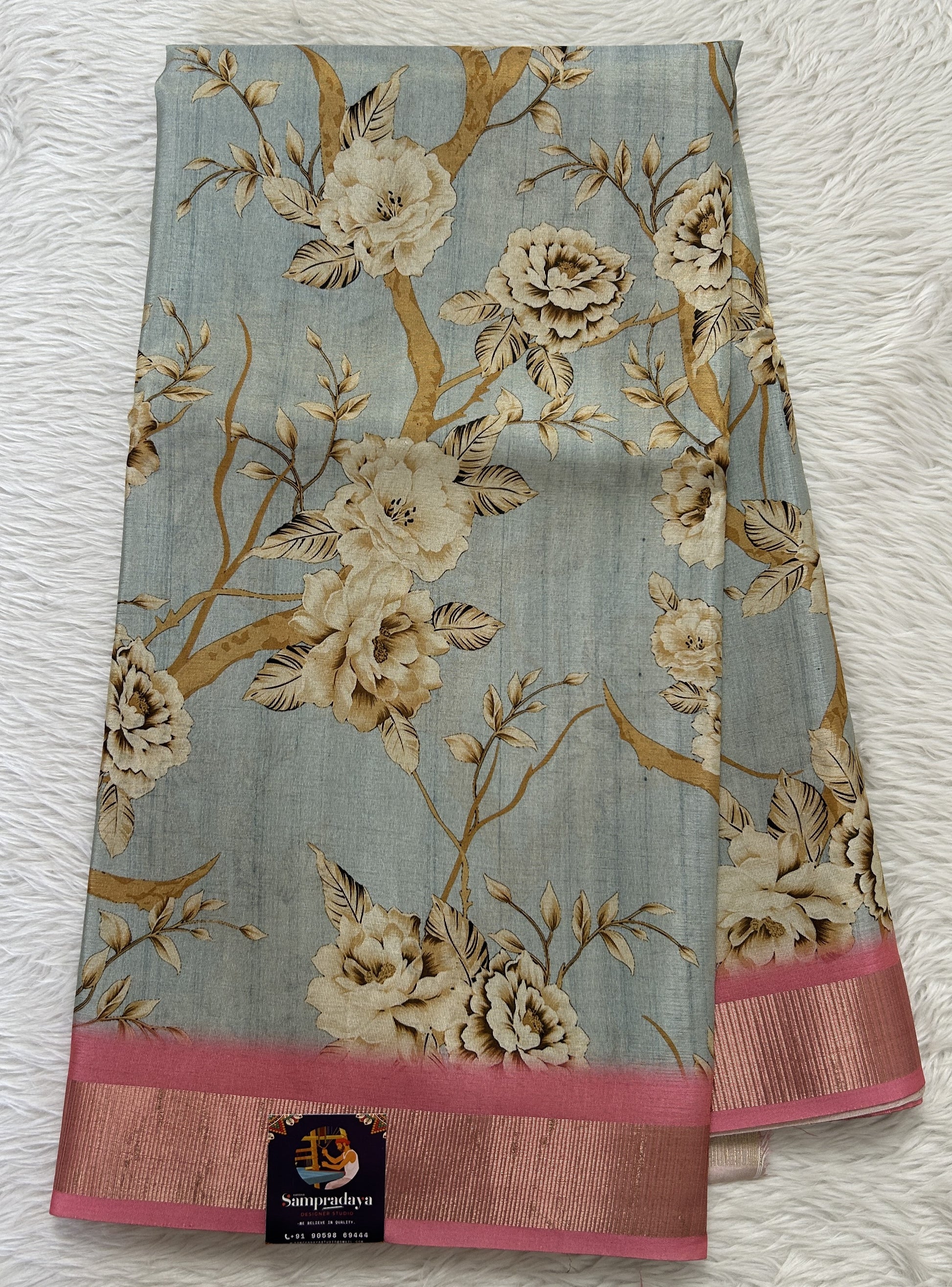Semi Tussar Tissue Designer Saree Pastel Blue colored complemented with a Pink Color Zari Border. - Sampradaya Designer Studio