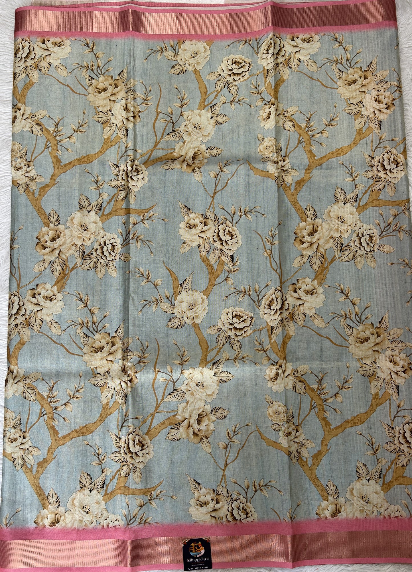 Semi Tussar Tissue Designer Saree Pastel Blue colored complemented with a Pink Color Zari Border. - Sampradaya Designer Studio