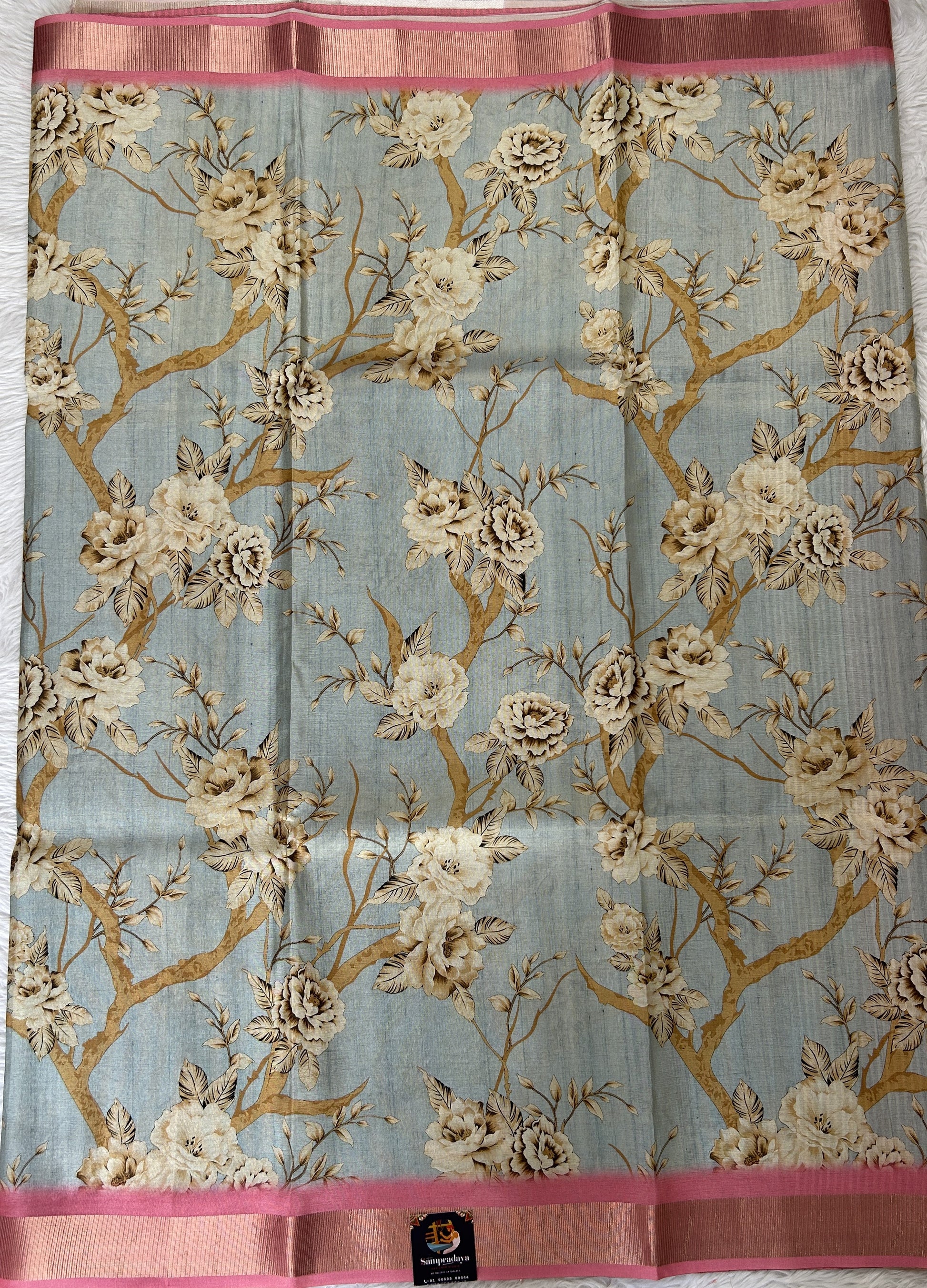 Semi Tussar Tissue Designer Saree Pastel Blue colored complemented with a Pink Color Zari Border. - Sampradaya Designer Studio