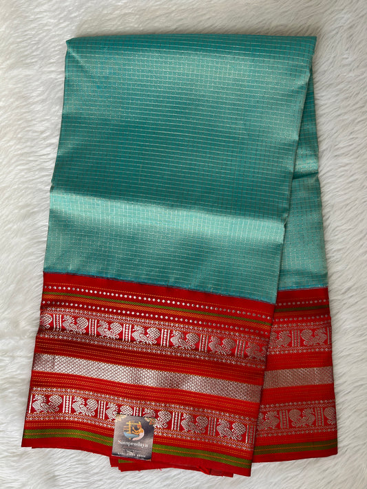 Venkatagiri Pattu Saree Sea Blue Colored Complemented With a Pattu Red Color Gap Border - Sampradaya Designer Studio