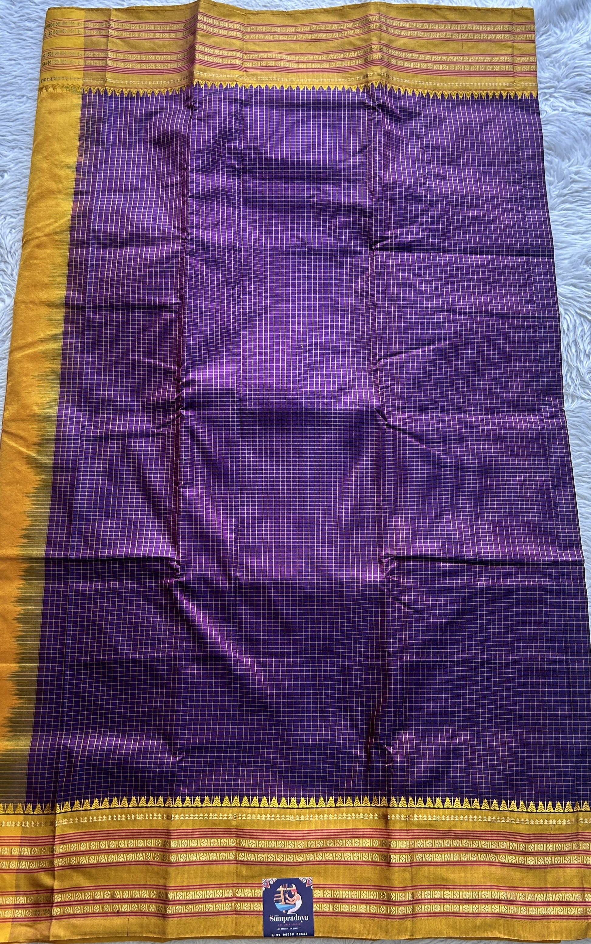 Narayanpet Silk Checks Saree Purple Colored Complemented with a Yellow Zari Border. - Sampradaya Designer Studio