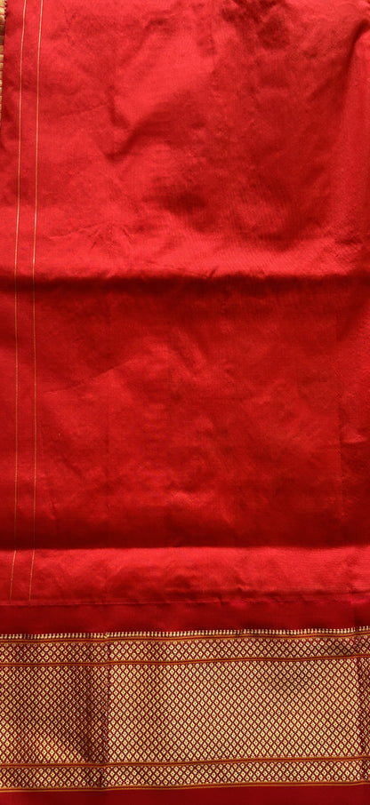 Narayanpet Silk Saree Orange Colored Complemented with a Zari Border. - Sampradaya Designer Studio