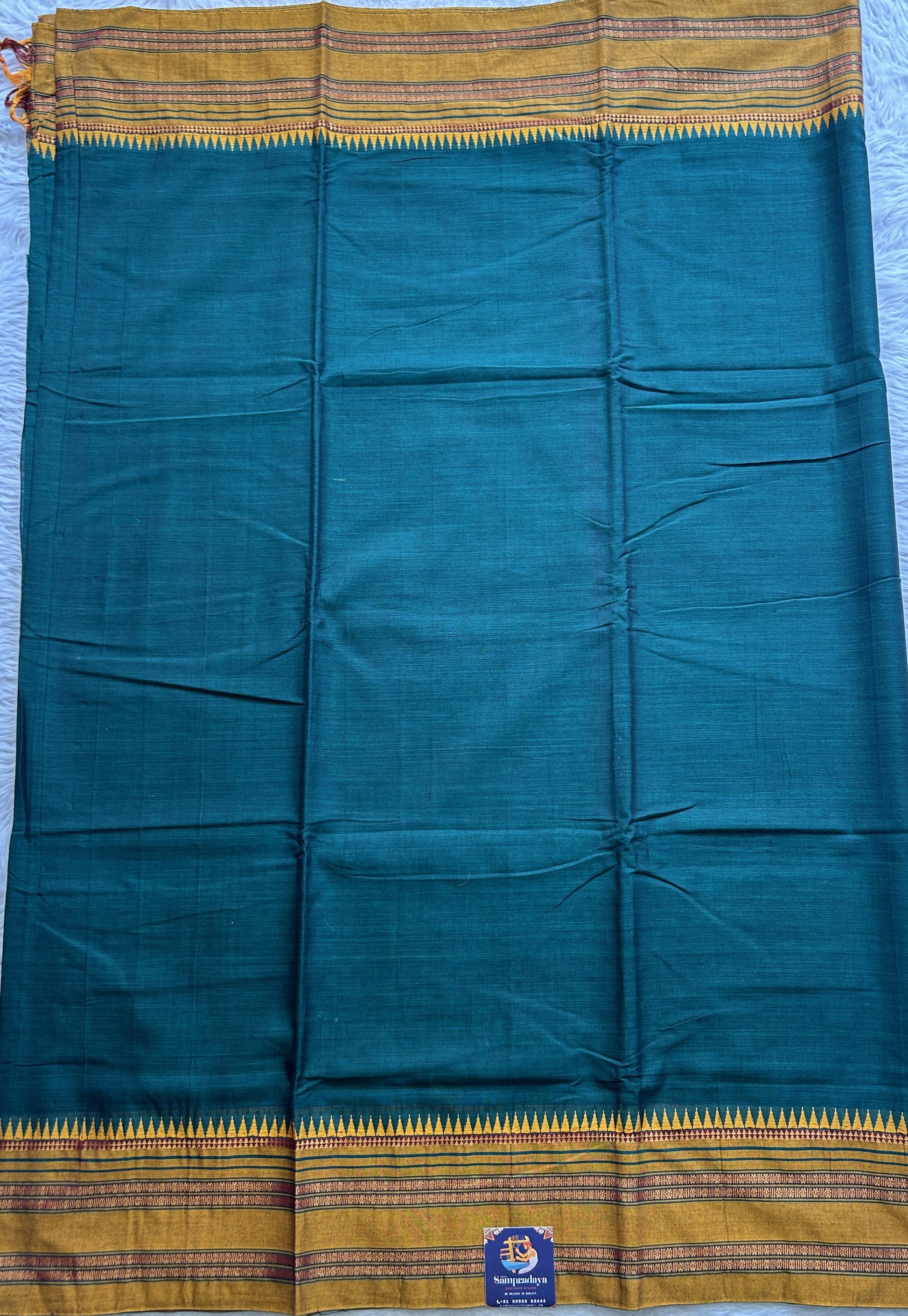 Narayanpet Cotton Saree Dark Green Colored Complemented with a Thread Border. - Sampradaya Designer Studio