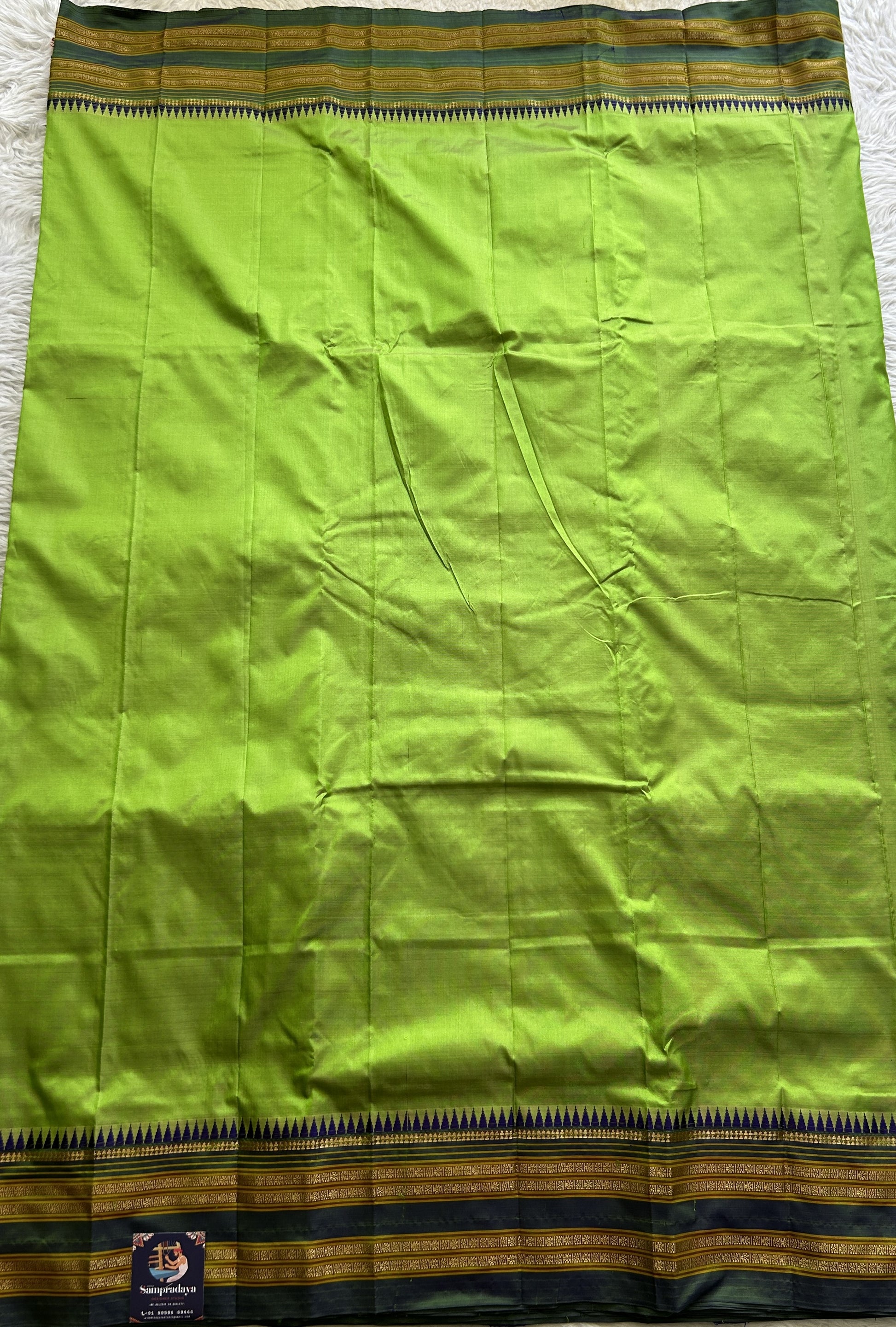 Narayanpet Silk Saree Parrot Green Colored Complemented with a Zari Border. - Sampradaya Designer Studio