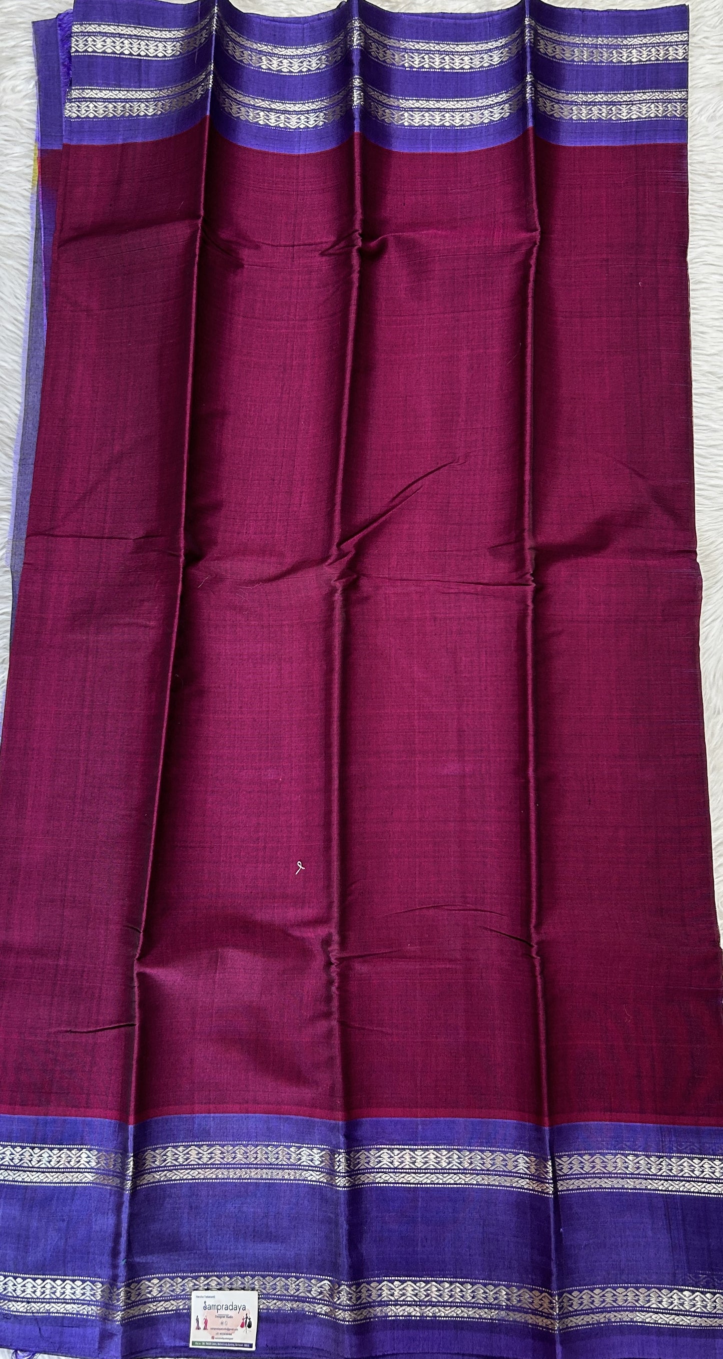 Gadwal Sico Saree Wine colored complemented with a Ink Blue Kanchi Gap Border. - Sampradaya Designer Studio