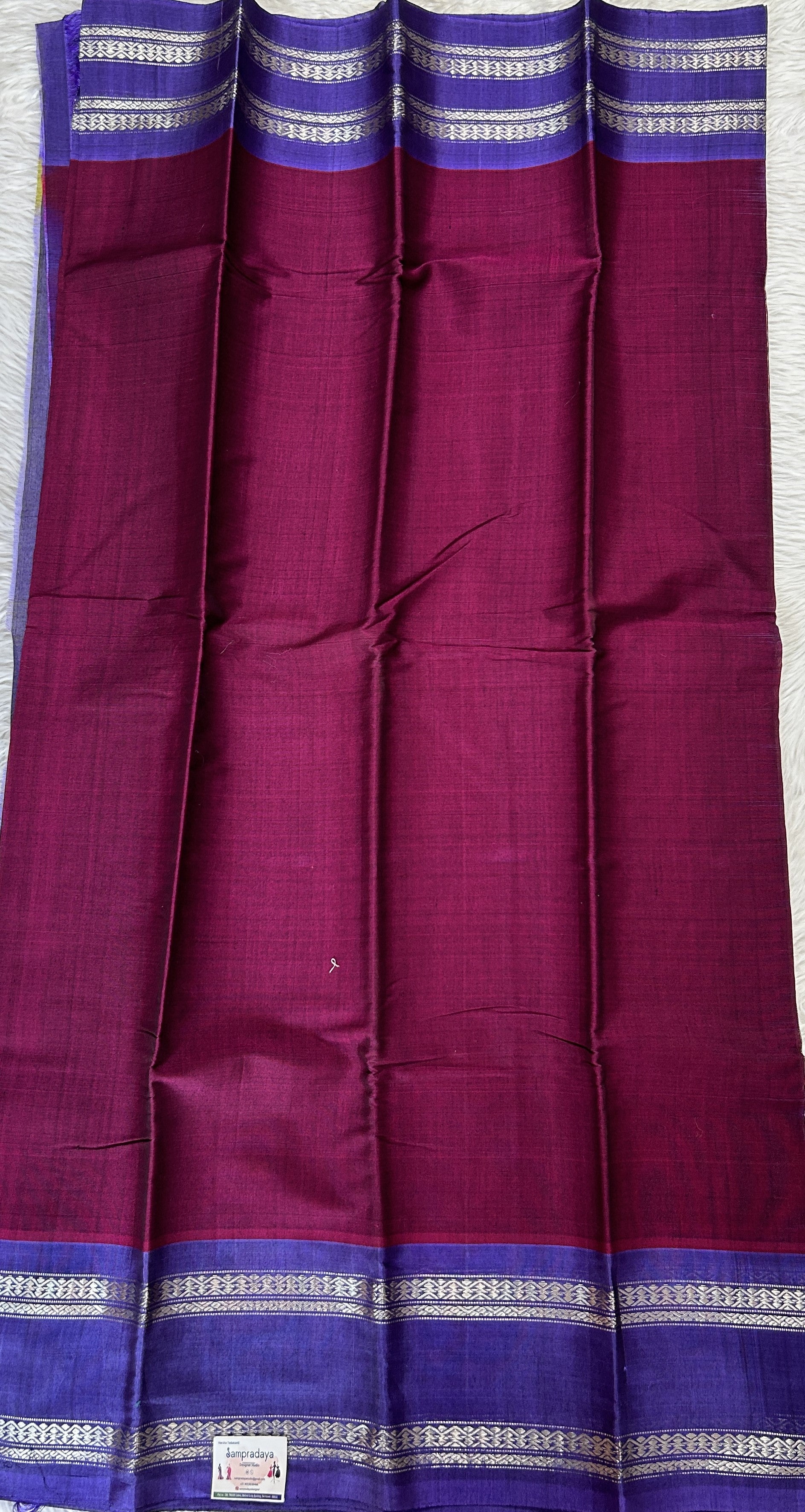 Gadwal Sico Saree Wine colored complemented with a Ink Blue Kanchi Gap Border. - Sampradaya Designer Studio