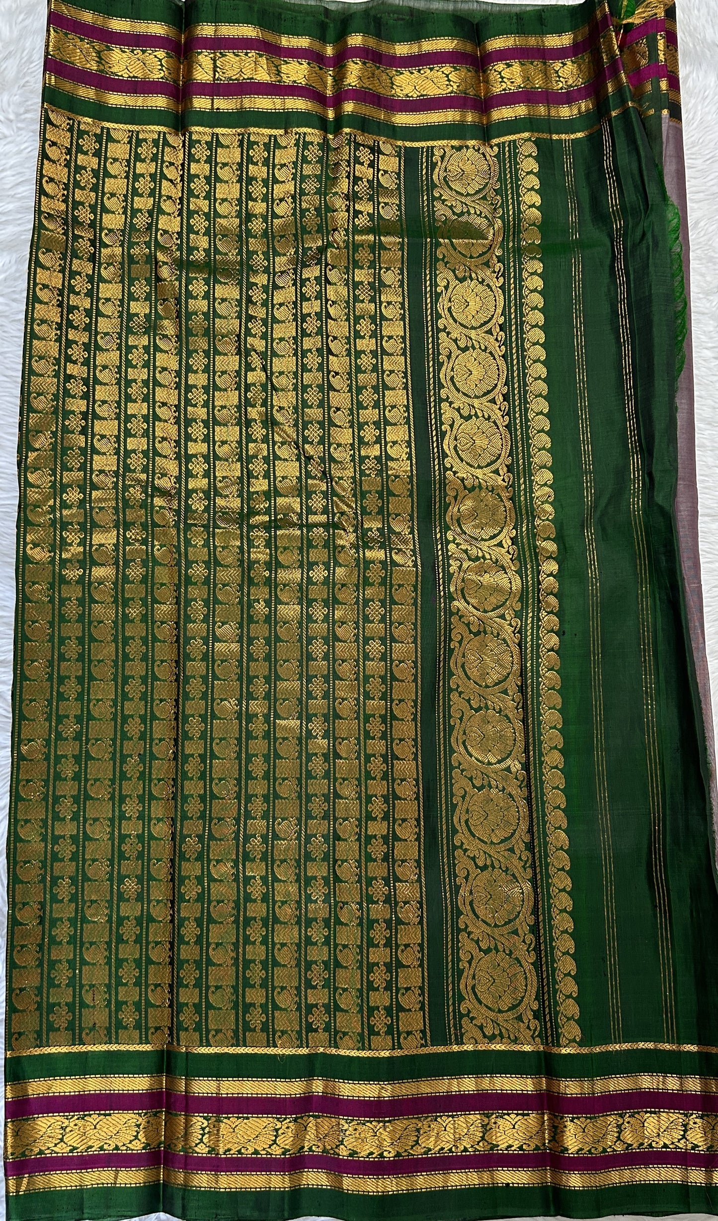 Gadwal Sico Saree Gray colored complemented with a Green Kanchi Gap Border. - Sampradaya Designer Studio