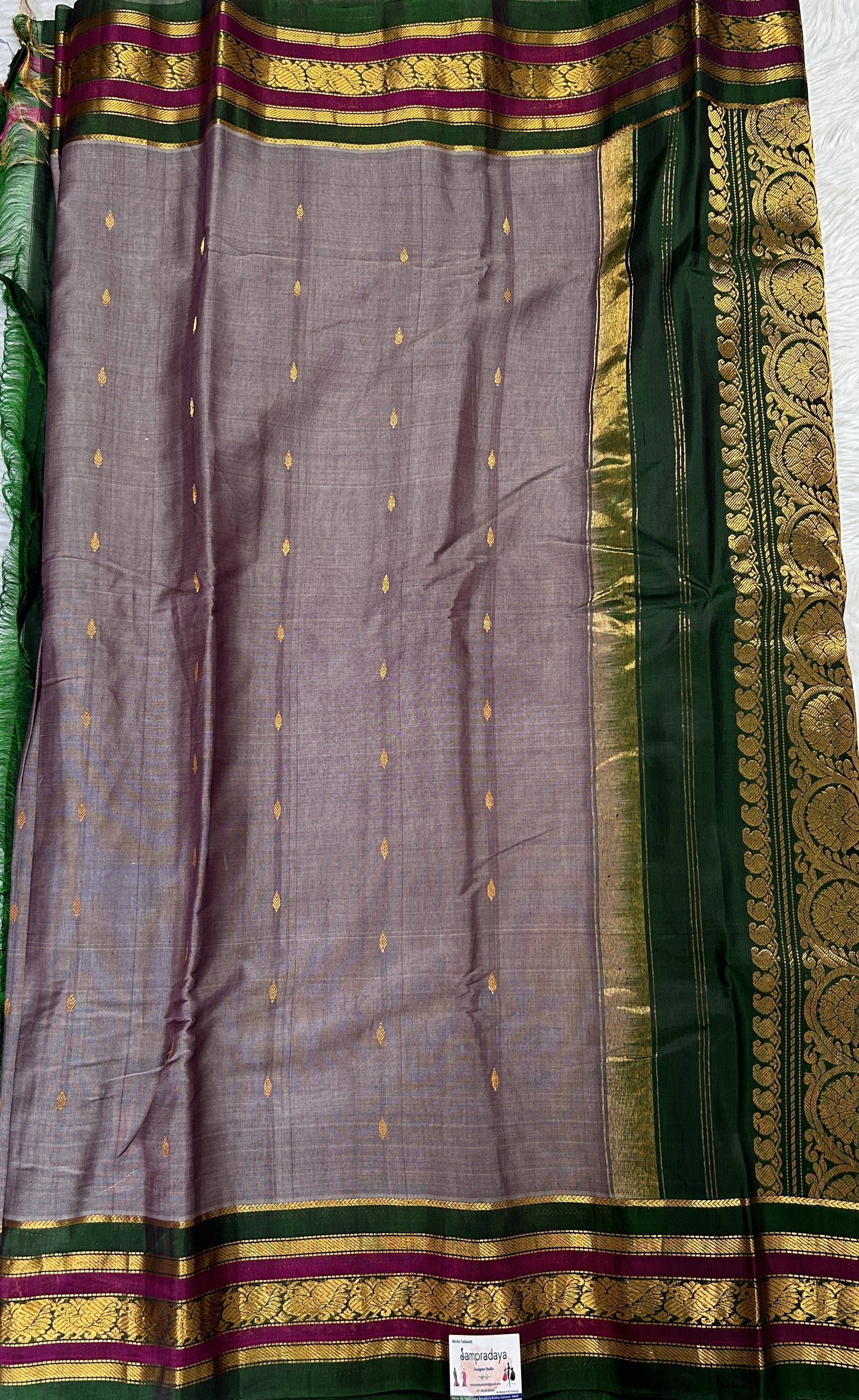 Gadwal Sico Saree Gray colored complemented with a Green Kanchi Gap Border. - Sampradaya Designer Studio